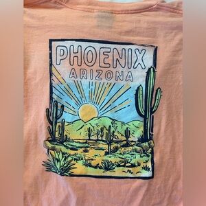 Phoenix peach-colored long-sleeve t-shirt with a desert graphic